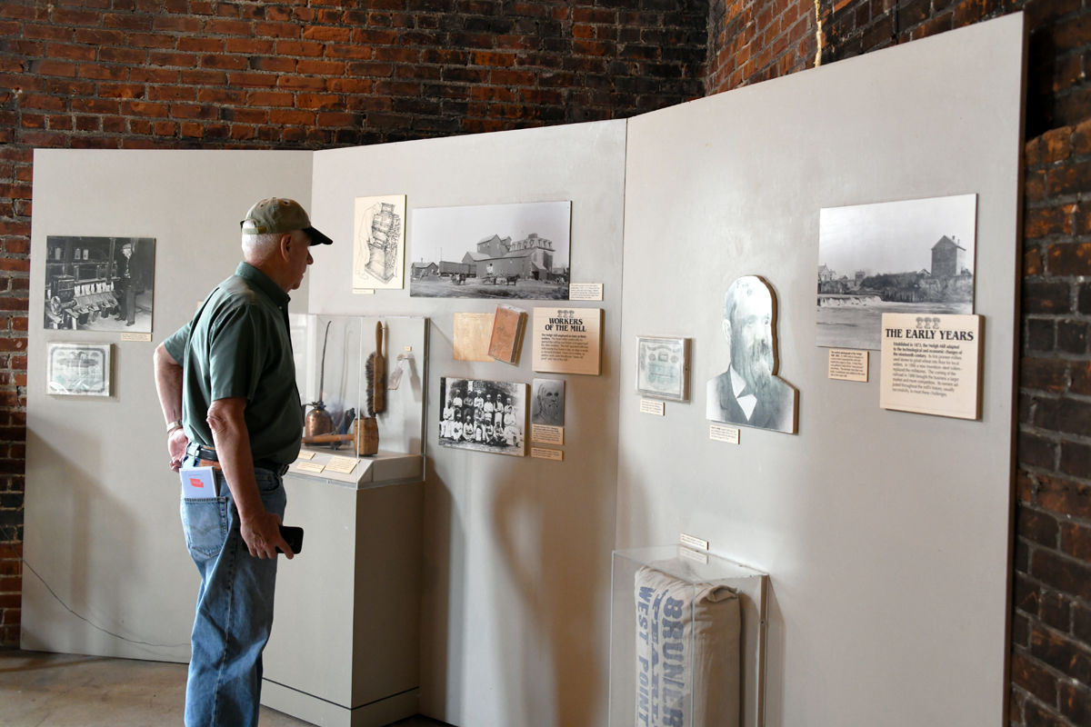 015 Franklin Hronik views the historic display at the Neligh Mill.JPG